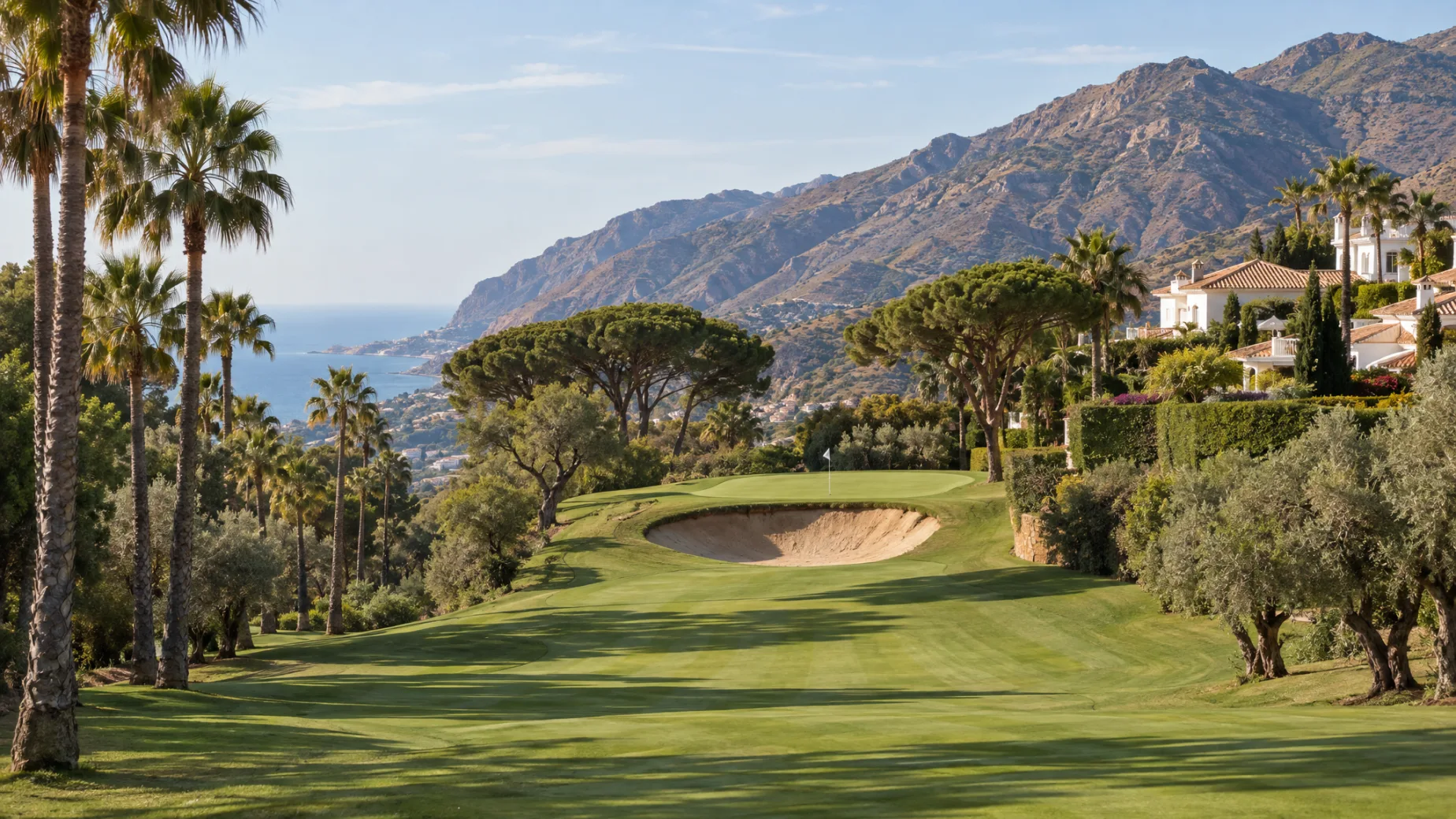 Properties for sale at El Paraíso Golf: new homes above a fairway lined with palms and pines on the New Golden Mile