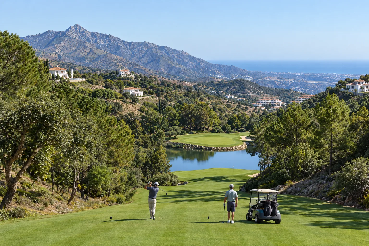 A hillside fairway at Marbella Club Golf Resort with a lake and new homes above it in Benahavís